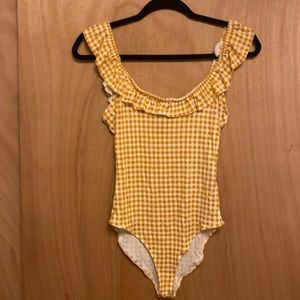Yellow checkered body suit